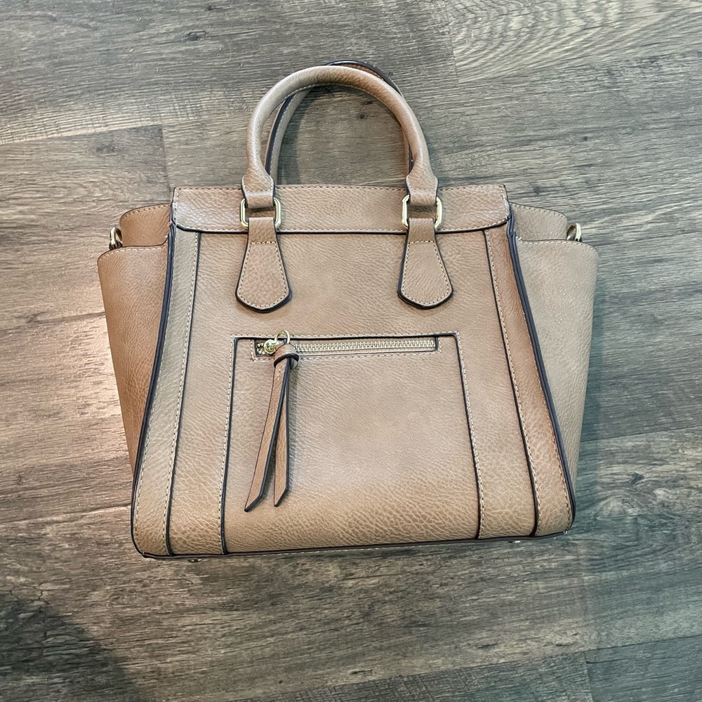 CHARMING CHARLIE PURSE. Beautiful brown shade and includes an optional strap.